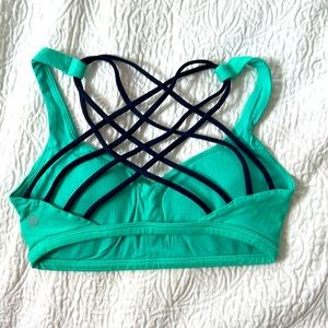 Lululemon free to be wild sports bra in green and dark blue size 4